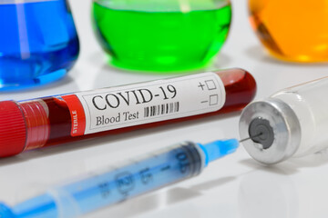 COVID-19 laboratory test tube and laboratory sample of blood testing for diagnosis coronavirus infection medicines and pharmacology
