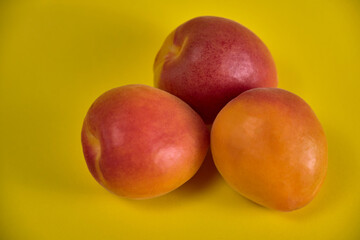 Fresh juicy apricots in a transparent glass plate. Macro.