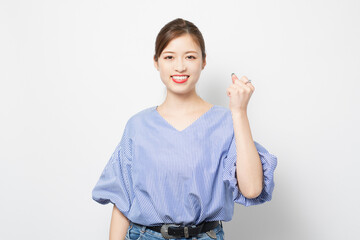 Obraz premium ガッツポーズをする若い女性