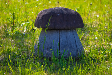 Mushroom boletus made of wood in the yard