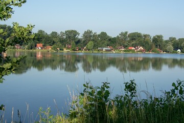 Lake along gravel pit near Hustopece and cottage. Moravia. Czechia. Europe.