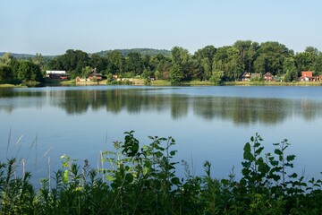 Obraz na płótnie Canvas Lake along gravel pit near Hustopece and cottage. Moravia. Czechia. Europe.