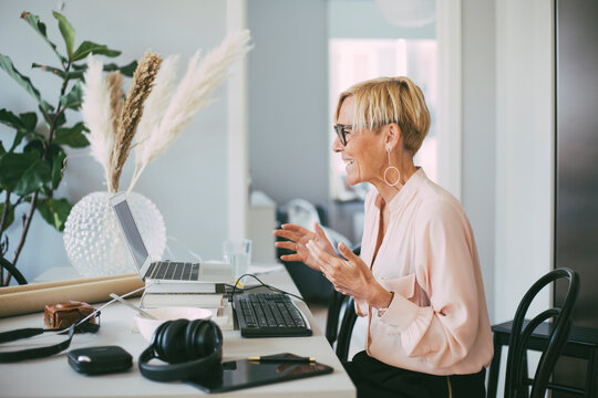 Profile of woman attending video conference at home