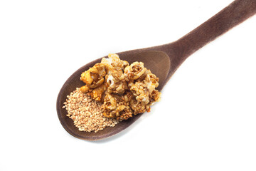 Side view of gourmet sesame seed popcorn over white background.