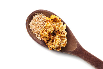 Side view of gourmet sesame seed popcorn over white background.