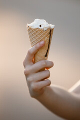 ice cream waffle cone in hand