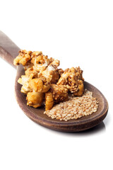 Side view of gourmet sesame seed popcorn over white background.