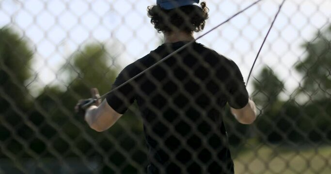 Sports stretching in the field. Baseball pitcher. Baseball player stretches before a game. Shot in 4k.
