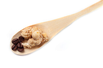 Amazing view of gourmet cinnamon and coffee popcorn with rustic utensils over a white background.
