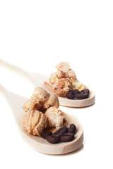 Rustic cup of gourmet cinnamon popcorn on white background.