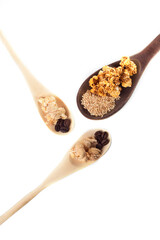 Amazing view of gourmet cinnamon and coffee popcorn with rustic utensils over a white background.