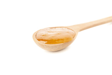 Fototapeta na wymiar Spoon with orange jam isolated on white background