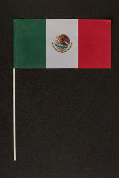 Table Flag Of Mexico On Black Background. Striped Tricolor Green White Red. Vertical Frame