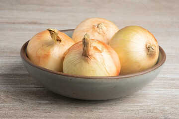 Whole Sweet Onions In A Bowl