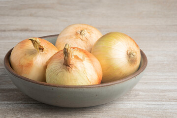Whole Sweet Onions In A Bowl