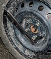 Tighten the wheel nut with a wrench