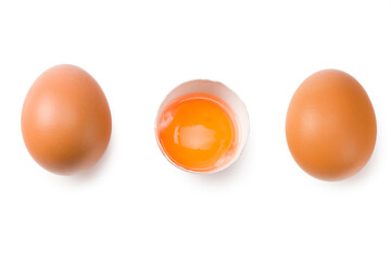 Chicken egg is half broken among other eggs isolated on white background. Top view