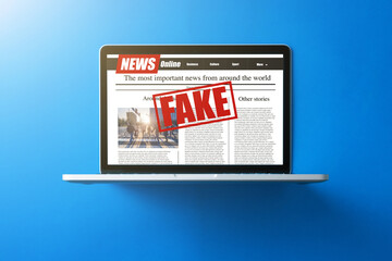 Online fake news on a laptop screen. Mockup website. Newspaper and portal on internet. concept of disinformation and propaganda