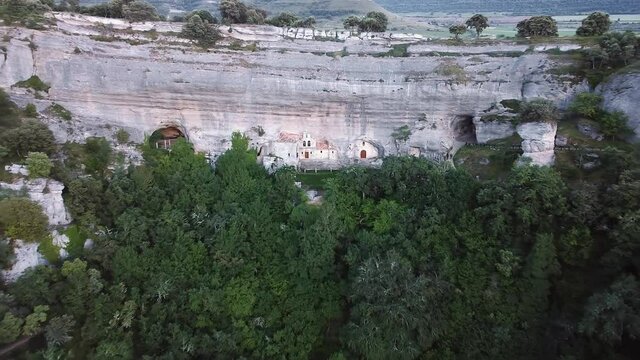 Aerial view of Saint Bernabe Ancient Heremitage in a cave in Ojo Guarena, Burgos, Spain. High quality 4k footage