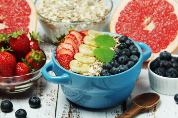 Healthy diet breakfast including cereal with berry and fruits