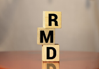 wooden block with words RMD required minimum distributions