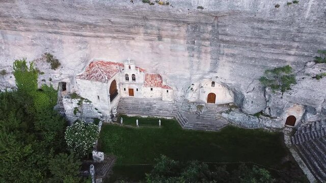 Aerial view of Saint Bernabe Ancient Heremitage in a cave in Ojo Guarena, Burgos, Spain. High quality 4k footage