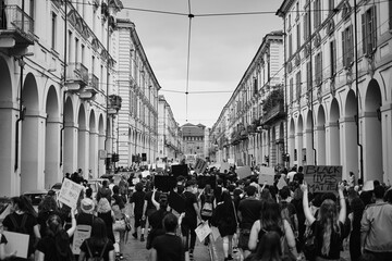 Antifa protester marching in the street of turin in support of BLM black lives matter movement 