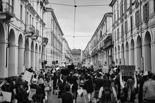 Antifa protester marching in the street of turin in support of BLM black lives matter movement 