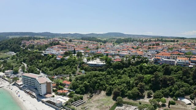 Drone shot from waterfront to the most popular village in Halkidiki- Kallithea. It is located in the first peninsula of Halkidiki, Kassandra.
