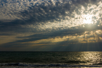 Amazing sea sunset, the sun, waves, clouds