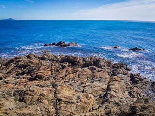 beautiful rocky coast, azure water and blue sky in Sunny weather in Saint Aygulf, France