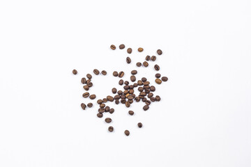 Coffee beans are scattered on a white background.