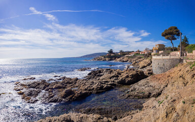 beautiful rocky coast, azure water and blue sky in Sunny weather in Saint Aygulf, France
