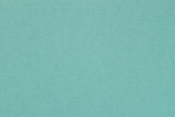 Texture of paper, light green mint color. Recyclable material. Fashionable modern background