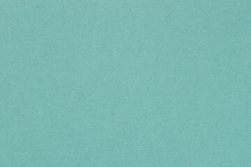 Texture of paper, light green mint color. Recyclable material. Fashionable modern background