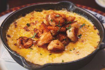 Mac and cheese prawns. Macaronis au gratin with cheddar cheese and prawns sauteed in white wine.