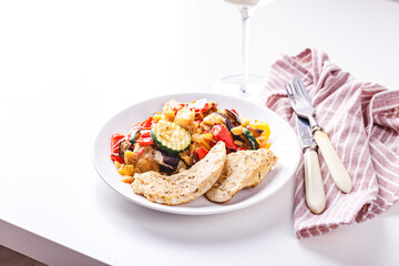 Grilled vegetables and fried chicken breast