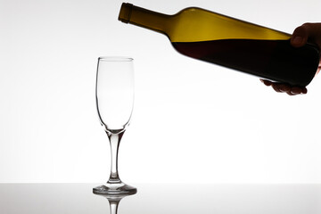 bottle of wine and wineglass on white background