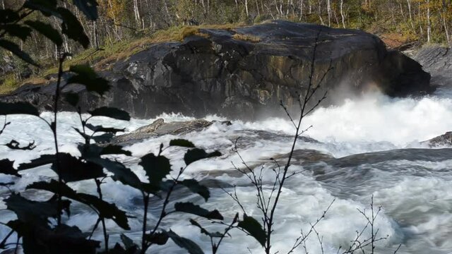 fast flowing river in autumn