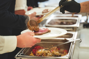 Two stainless hotel pans on food warmers. Warm vegetable as side dishes. Self-service buffet table....