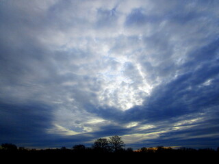 blue sky with storm clouds over the head