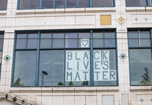 Seattle, WA - 11 June 2020 Protest in the city, Capital Hill neighborhood. Capitol Hill Autonomous Zone. 
Black Lives Matter sign held at protest on streets and buildings. 
