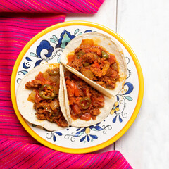 Mexican chorizo tacos on white background