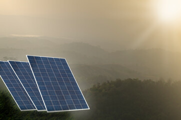 Solar panels with a backdrop of mountains and yellow light