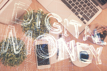 Double exposure of blockchain theme hologram over table with phone. Top view. Crypto technology...