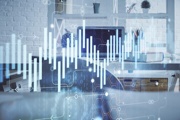 Double exposure of financial graph drawing and office interior background. Concept of stock market.