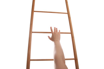 Woman climbing up wooden ladder against white background, closeup