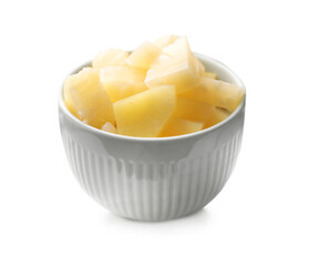 Pieces of canned pineapple in bowl on table, closeup