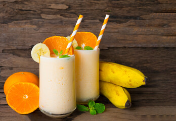 Banana and orange smoothies yellow colorful fruit juice milkshake blend beverage healthy high...