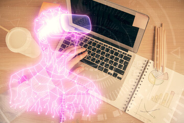 Double exposure of man's hands typing over computer keyboard and virtual reality hologram drawing. Top view. Technology concept. Future.